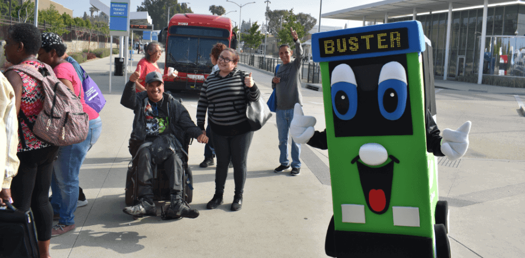 Buster with people at transit center