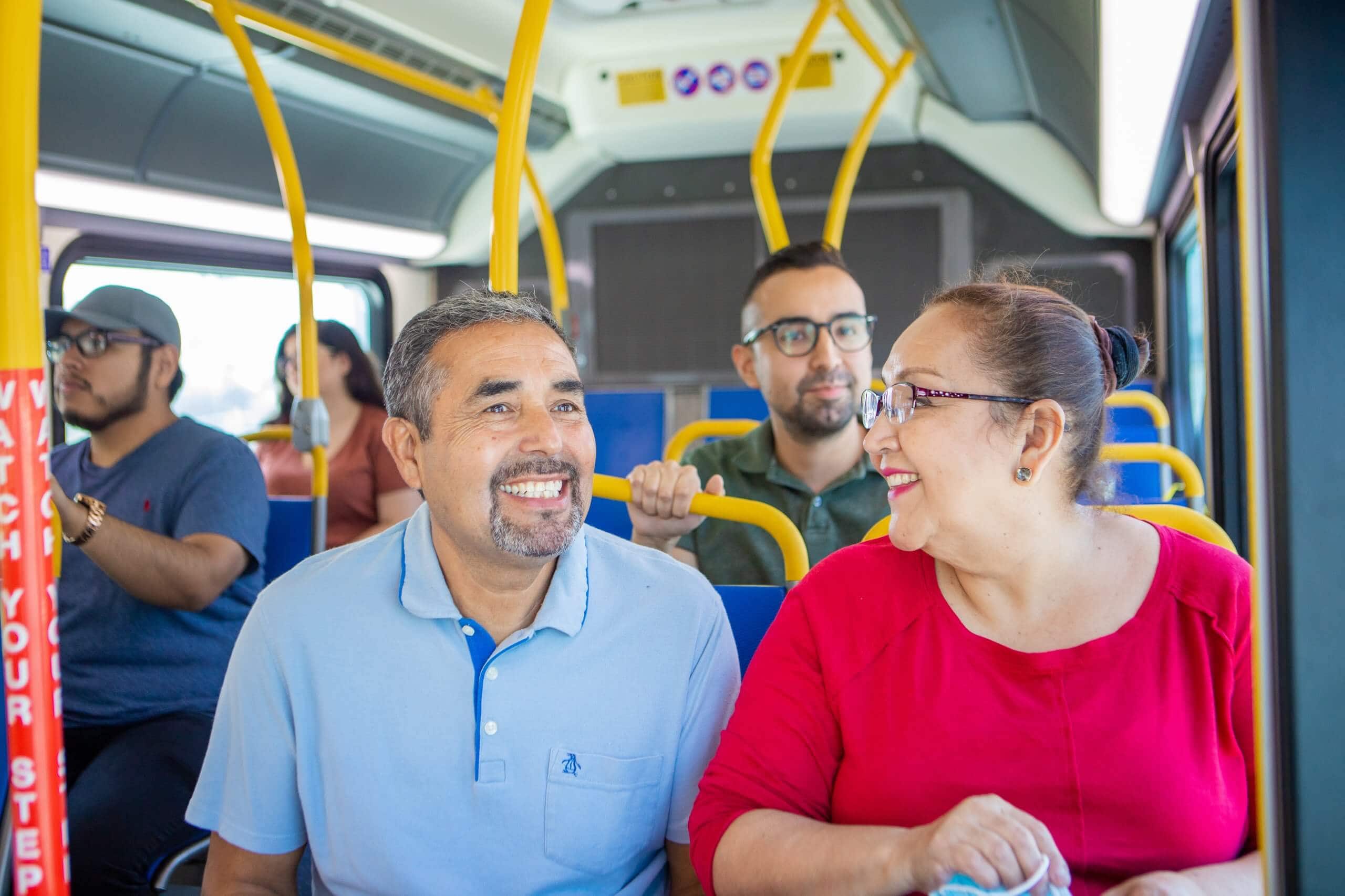 Smiling customers on bus