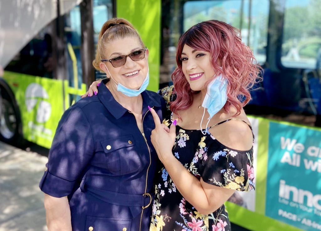 Denise Reyes and her mother in front of Omnitrans bus